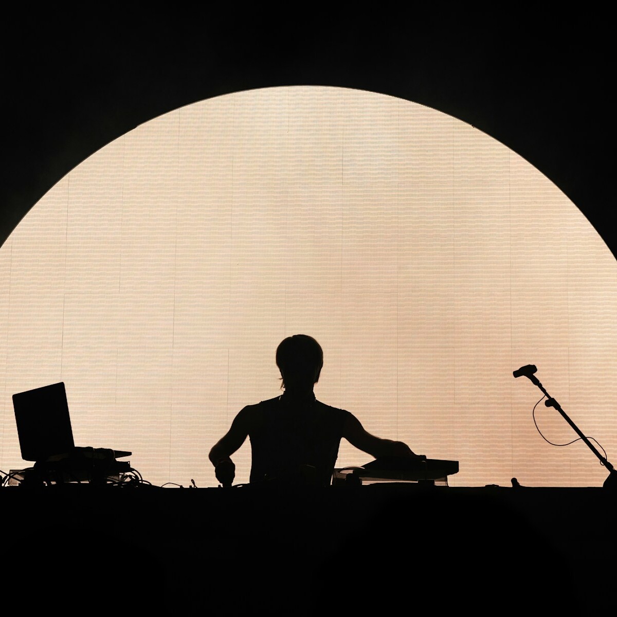 man in black shirt playing guitar